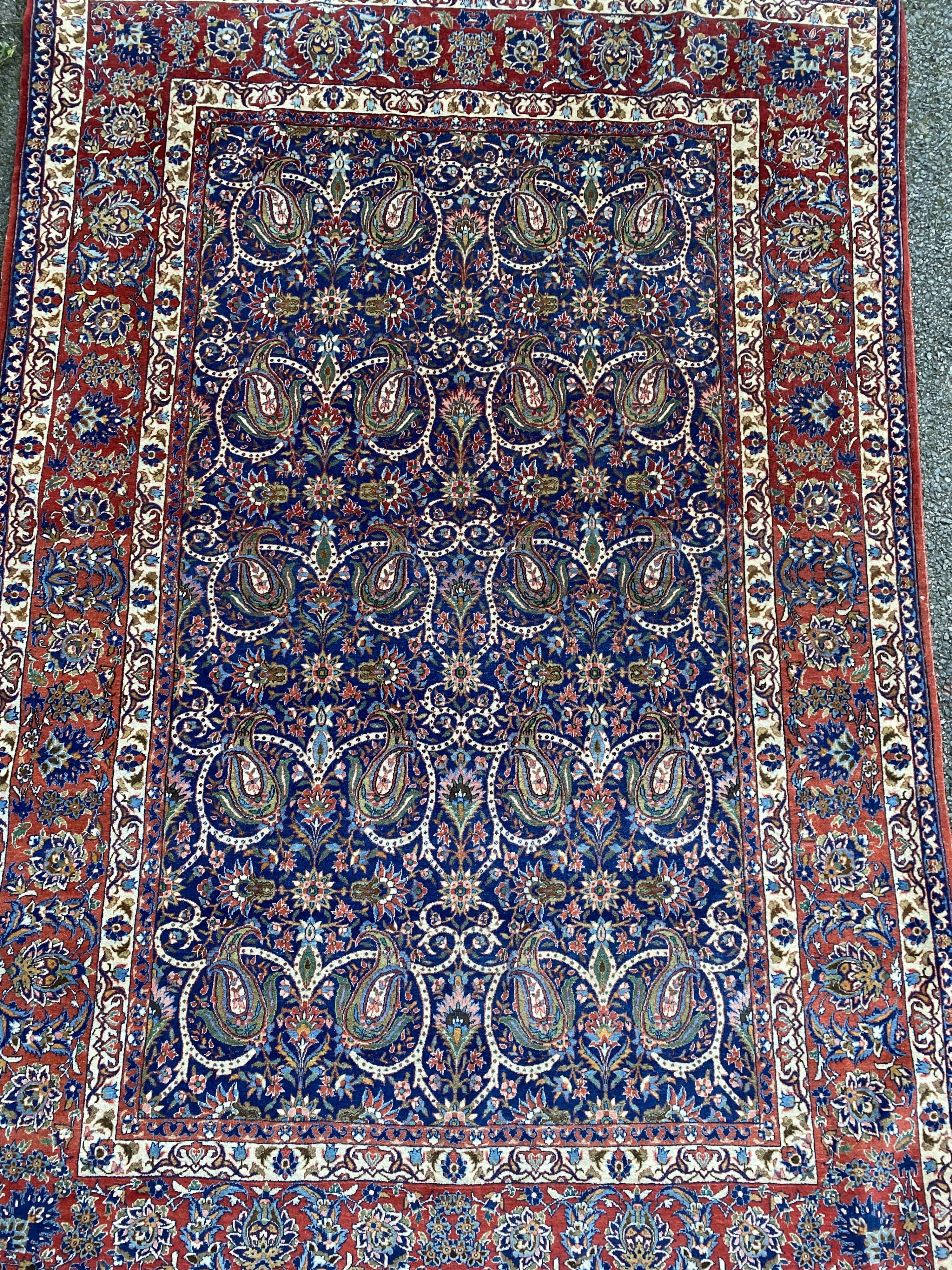 A Tabriz blue ground rug, first half 20th century, 225 cm x 155 cm